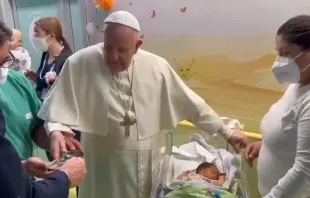 Pope Francis baptizes a baby at Gemelli Hospital in Rome on March 31, 2023. Credit: Screen shot of Vatican Media video