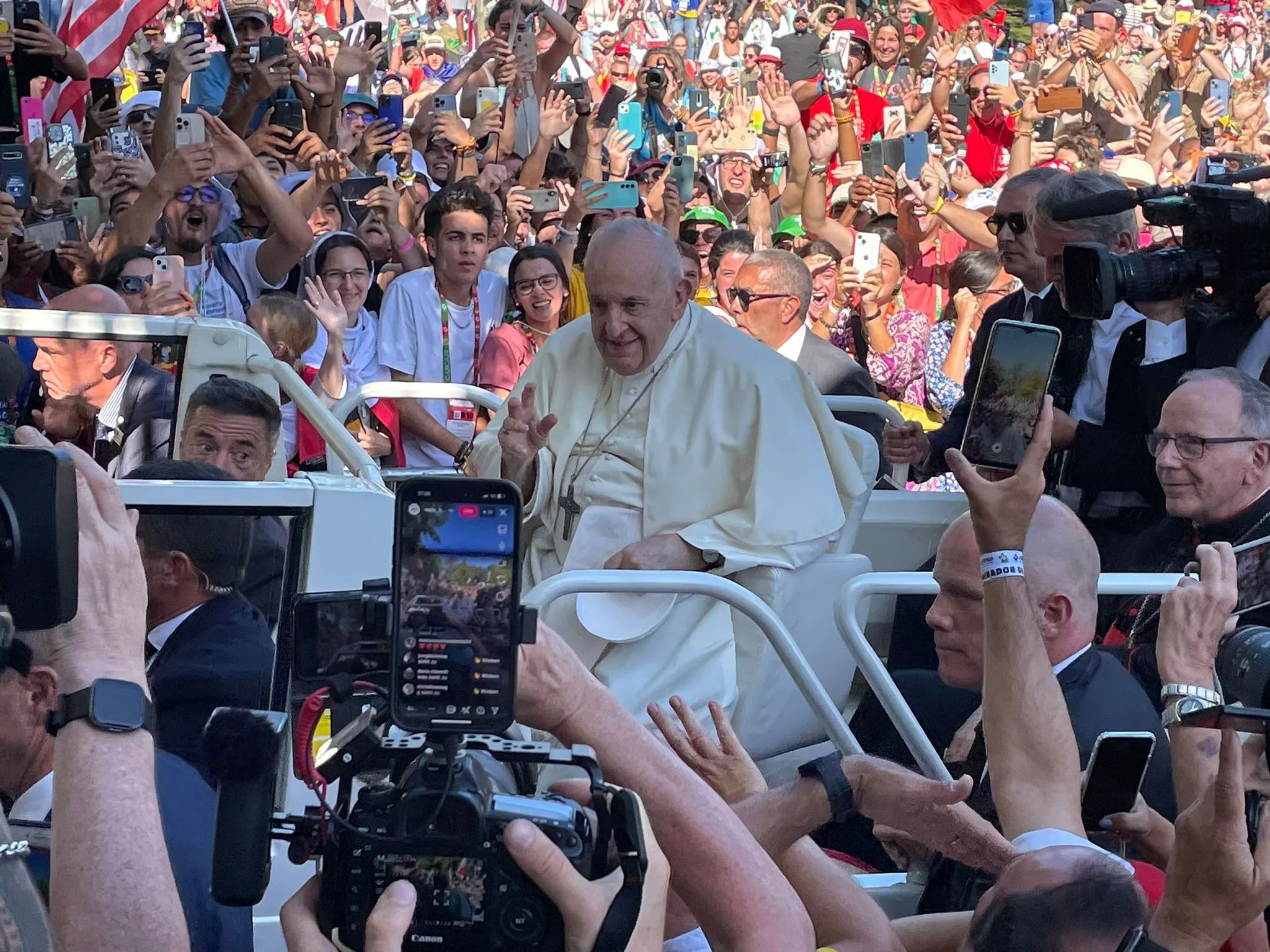 Pope Francis makes his way past crowds of thousands on his way to the World Youth Day welcoming ceremony in Lisbon, Portugal, Aug. 3, 2023.?w=200&h=150