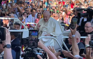 Pope Francis makes his way past crowds of thousands on his way to the World Youth Day welcoming ceremony in Lisbon, Portugal, Aug. 3, 2023. Credit: Pablo Pilco/EWTN News