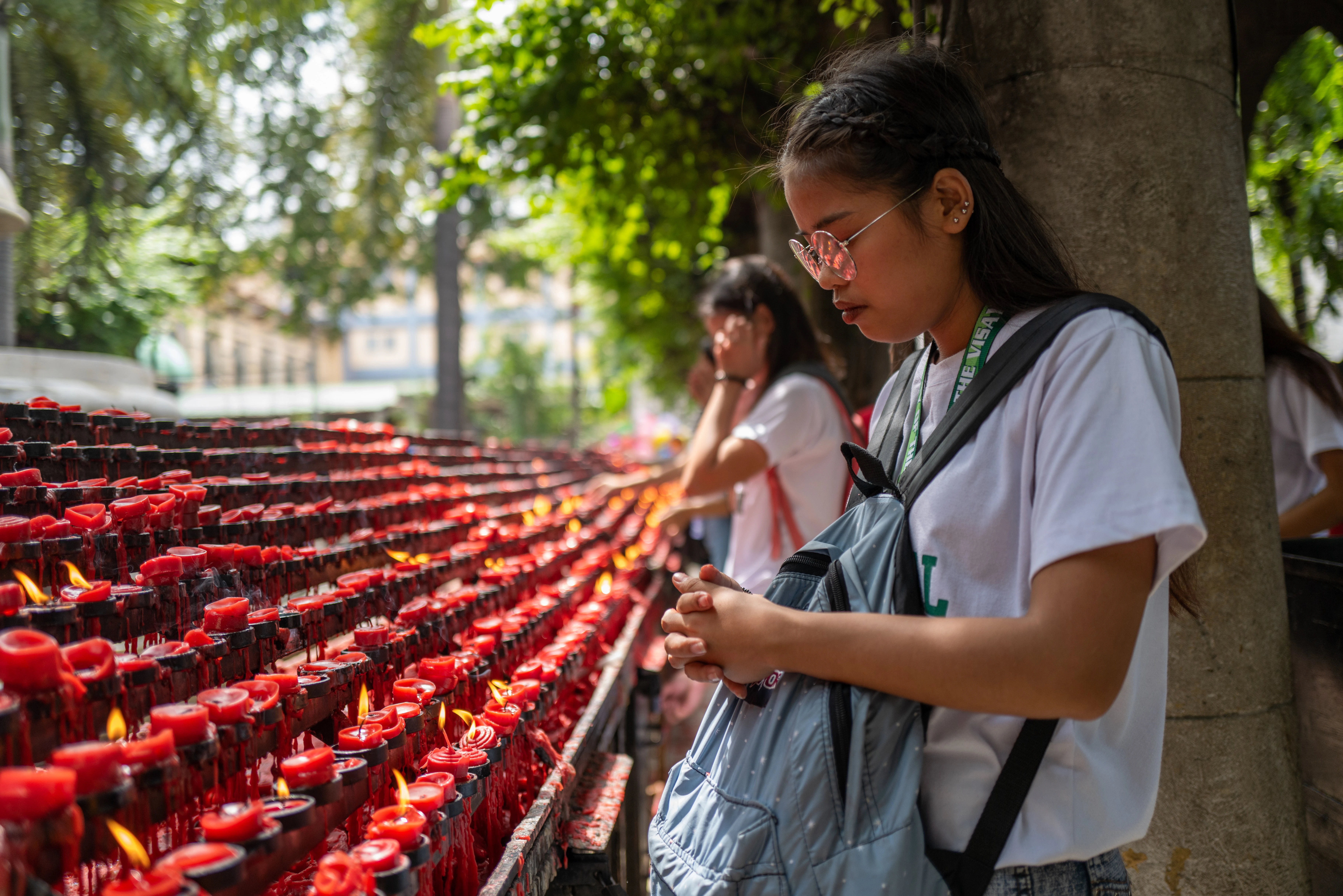 A girl praying at the Basilica del Santo Niño in Cebu, Philippines in 2019.?w=200&h=150