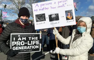 At the Jan. 23, 2021 Philadelphia March for Life, Luke Parlee and his mother Terry of Our Lady of Guadalupe Parish in Buckingham, Pennsylvania, displayed ultrasound images of his development at six and 33 weeks alongside his high school senior portrait. Gina Christian/CatholicPhilly.com