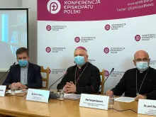 Bishop Artur Miziński and Archbishop Georges Bacouni at a press conference in Warsaw, Poland, Nov. 10, 2021.