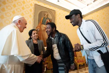 Pope Francis meets with refugees whom he helped to bring to Italy on Dec. 17, 2021.