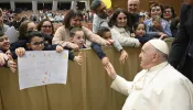 Pope Francis greets members of the public attending his weekly general audience in Paul VI Hall in Vatican City on Nov. 29, 2023.