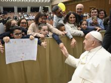 Pope Francis greets members of the public attending his weekly general audience in Paul VI Hall in Vatican City on Nov. 29, 2023.