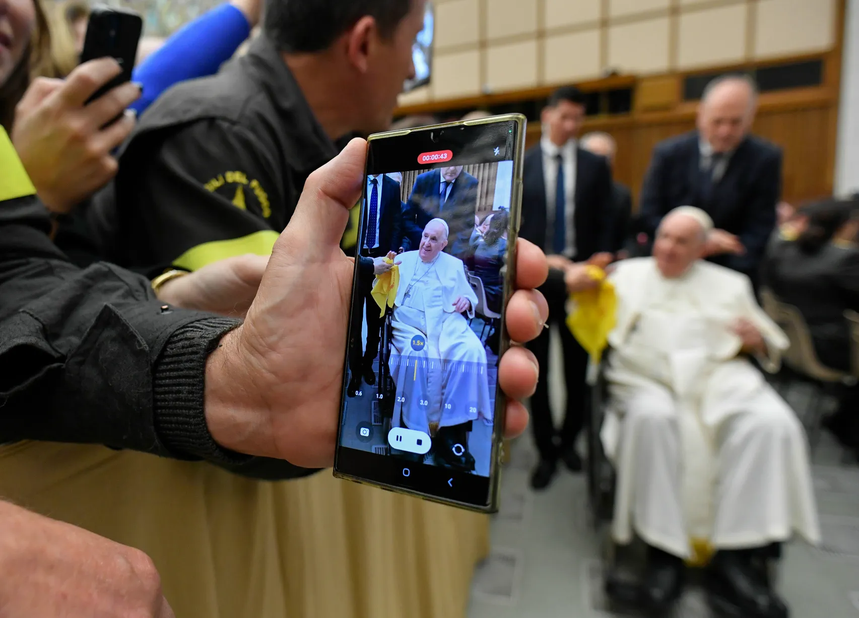 A person takes a photo of Pope Francis on a cell phone during a papal audience on Dec. 10, 2022.?w=200&h=150