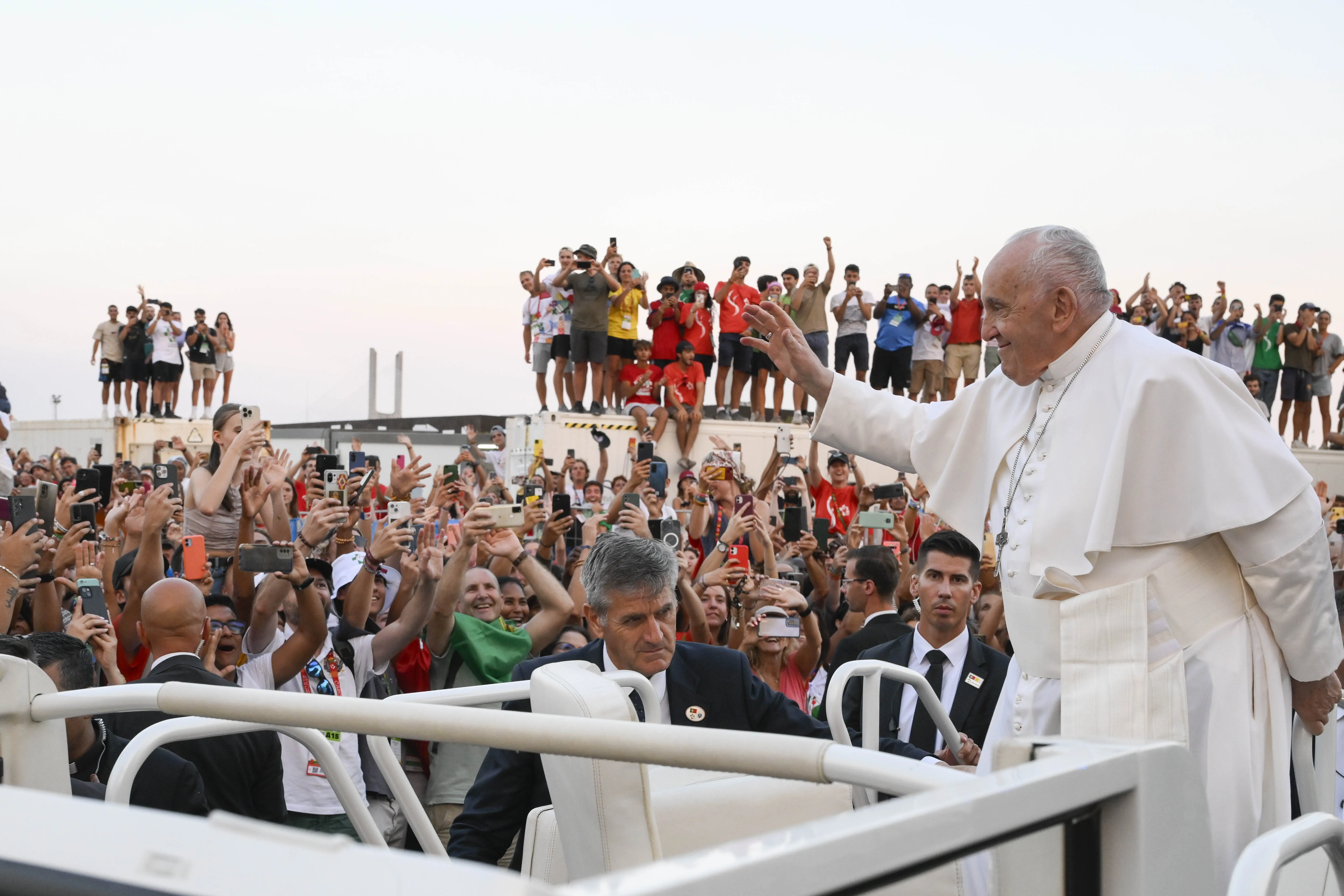 Pope Francis waves to World Youth Day pilgrims in Lisbon, Portugal, at the start of a vigil service on Aug. 5, 2023.?w=200&h=150