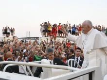 Pope Francis waves to World Youth Day pilgrims in Lisbon, Portugal, at the start of a vigil service on Aug. 5, 2023.