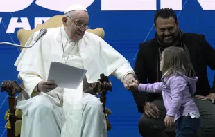 Pope Francis greets a young girl at a conference on Friday, May 10, 2024, on the state of birth rates in Italy and the wider West at the Auditorium della Conciliazione in Rome. Credit: Vatican Media