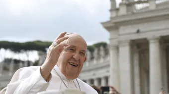 Pope Francis waves to pilgrims gathered in St. Peter’s Square for his Wednesday general audience on May 22, 2024, at the Vatican.