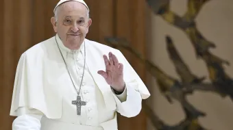 Pope Francis waves to pilgrims gather in Paul VI Audience Hall for his Wednesday general audience on March 27, 2024.