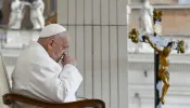 Pope Francis prays during his Wednesday general audience in St. Peter’s Square at the Vatican on April 24, 2024.