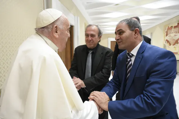 Pope Francis meets with two bereaved fathers — one Israeli, one Palestinian — before his general audience on Wednesday, March 27, 2024, at the Vatican. Credit: Vatican Media