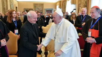 Pope Francis greets Archbishop Vincenzo Paglia, the president of the Pontifical Academy for Life, on Feb. 20, 2023.