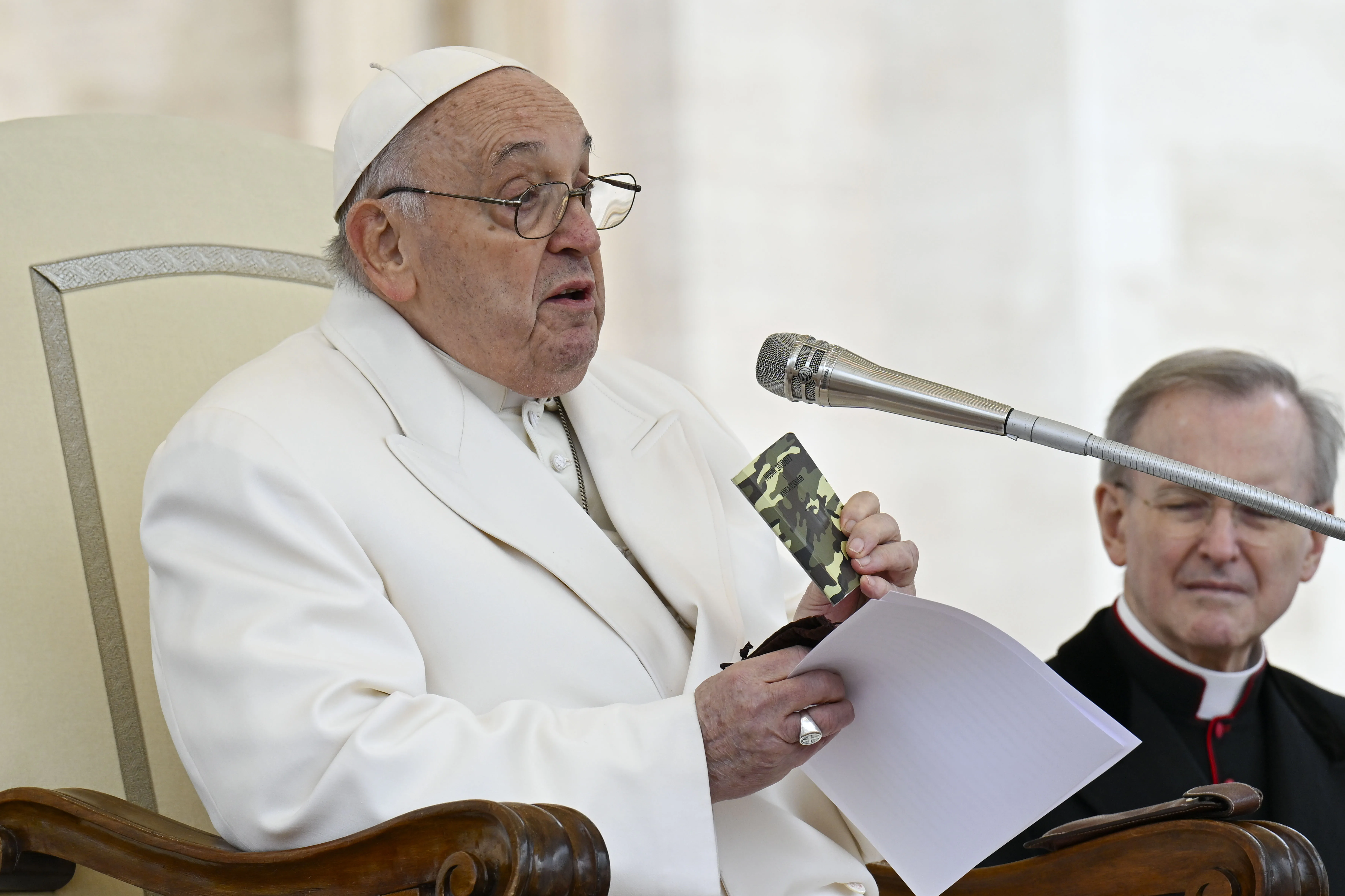 Pope Francis holds a rosary and New Testament that belonged to a slain 23-year-old Ukrainian soldier as he appeals for peace during his general audience on Wednesday, April 3, 2024.?w=200&h=150