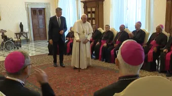 Pope Francis walks with a cane at the beginning of a meeting with Brazilian bishops on June 27, 2022.