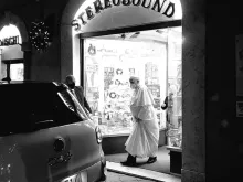Pope Francis is seen leaving a record store in Rome, Jan. 11, 2022.