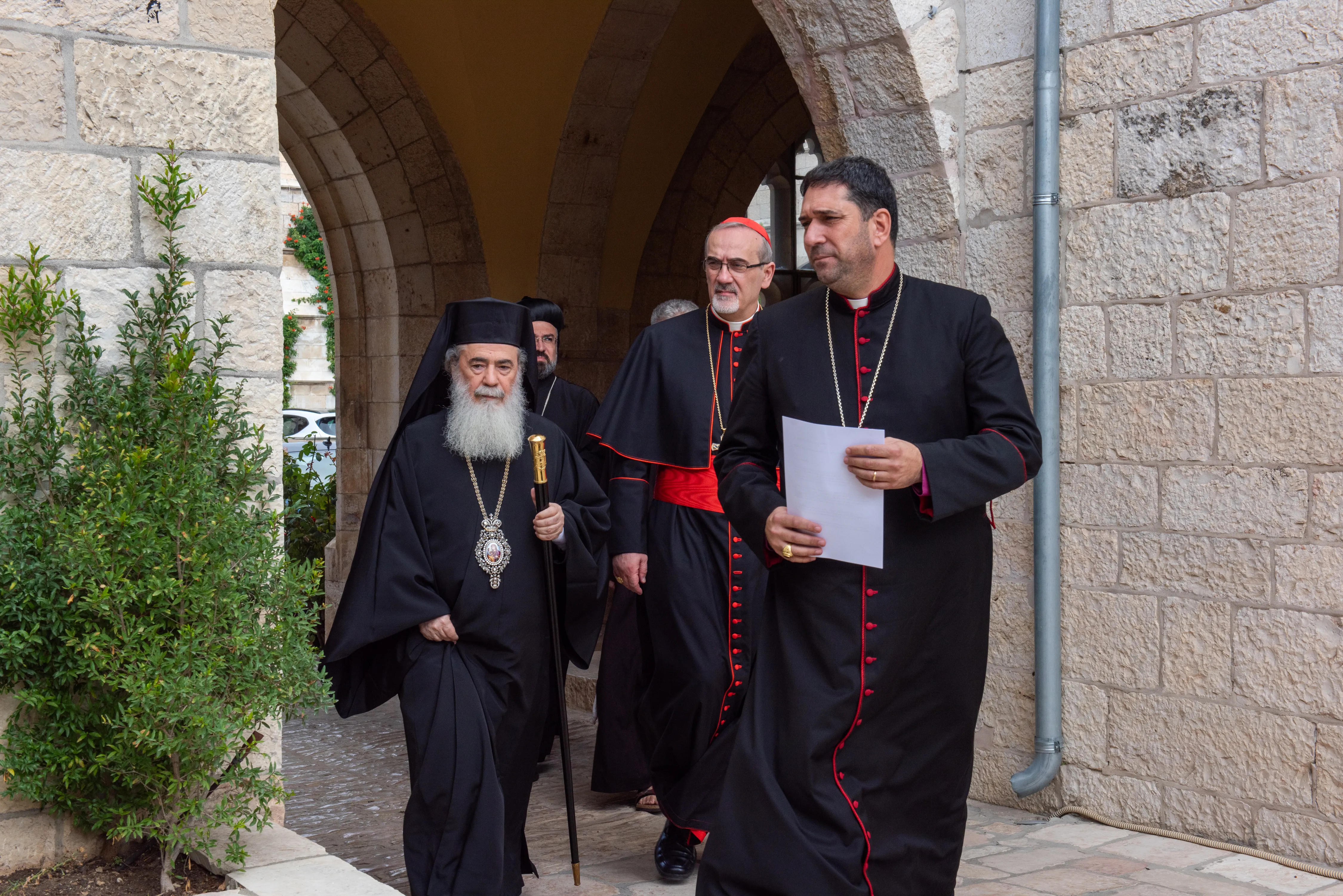 The Patriarchs and Heads of the Churches in Jerusalem arrive at a press conference, Oct 18, 2023. The Anglican bishop Hosam Naum is followed by Cardinal Pierbattista Pizzaballa, Latin patriarch of Jerusalem, and Theophilos III, Greek Orthodox patriarch of Jerusalem.?w=200&h=150