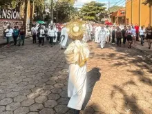 The vicar of the Archdiocese of Santa Cruz takes the Blessed Sacrament in procession through the streets of Santa Cruz, Bolivia, Oct. 30, 2022.