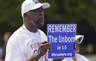 A man holds a sign at a pro-life rally in front of the Lincoln Memorial on June 24, 2023, marking the first anniversary of the U.S. Supreme Court's Dobbs decision overturning Roe v. Wade. Joseph Portolano/CNA