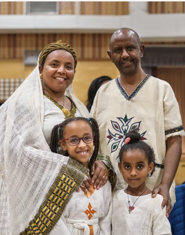 A refugee from Eritrea (pictured here with her family) shared her 10-year journey to find freedom at the post-Mass reception following this year's World Day for Migrants and Refugees Mass at St. Paul’s Parish in Richmond, British Columbia, Canada, Sept. 23, 2023. Credit: Nicholas Elbers