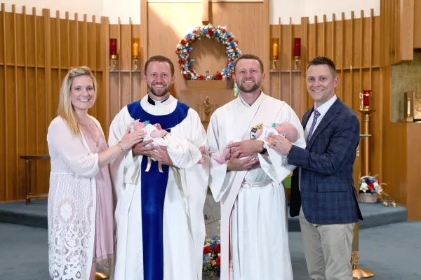 Parents Kristin and Luke Renwick with Father Ben Daghir, Deacon Luke Daghir, and their baptized twins, Gianna and Andrew Renwick. Credit: Don Wojtaszek
