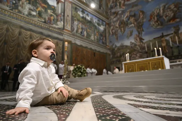 In his homily on Jan. 7, 2024, for the feast of the Baptism of the Lord, Pope Francis encouraged parents not to worry if their children cry or fuss during Mass. Credit: Vatican Media