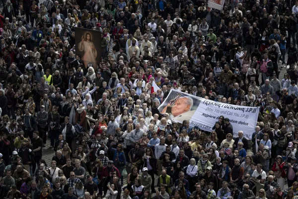 Groups hold images of St. John Paul II and Jesus of Divine Mercy in St. Peter's Square during Pope Francis' Regina Caeli on April 16, 2023. Vatican Media