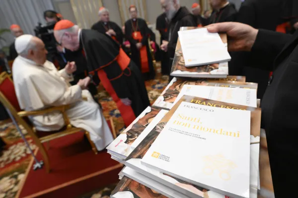 Following his custom, Pope Francis gave Vatican officials books as a Christmas gift during his meeting with cardinals of the Roman Curia on Dec. 21, 2023, in the gilded Hall of Benediction at the Vatican. Credit: Vatican Media