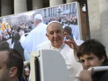 Pope Francis greets pilgrims at his general audience in St. Peter's Square at the Vatican on Oct. 18, 2023.