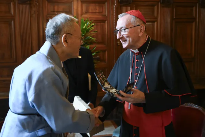 Vatican Secretary of State Cardinal Pietro Parolin greets Yu In-Chon