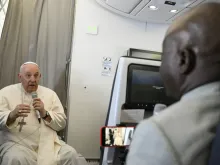 Pope Francis speaks to journalists on Feb. 5, 2023, during his flight back to Rome after his visit to the Democratic Republic of Congo and South Sudan.