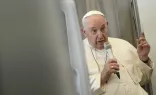 Pope Francis speaks to the media on Feb. 5, 2023, during his return flight to Rome from his visit to the Democratic Republic of Congo and South Sudan.