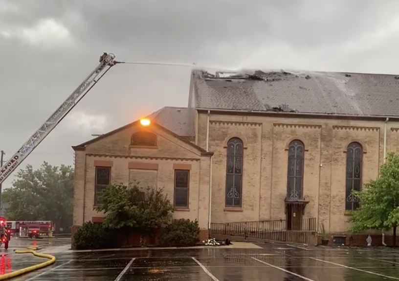 Firefighters work to put out a roof fire at historic St. James Catholic Church, in Rockford, Illinois, on Aug. 8, 2022. The Diocese of Rockford said a lightning strike was a possible cause.?w=200&h=150