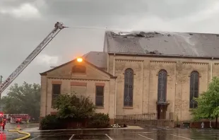 Firefighters work to put out a roof fire at historic St. James Catholic Church, in Rockford, Illinois, on Aug. 8, 2022. The Diocese of Rockford said a lightning strike was a possible cause. Screenshot of Rockford Diocese video