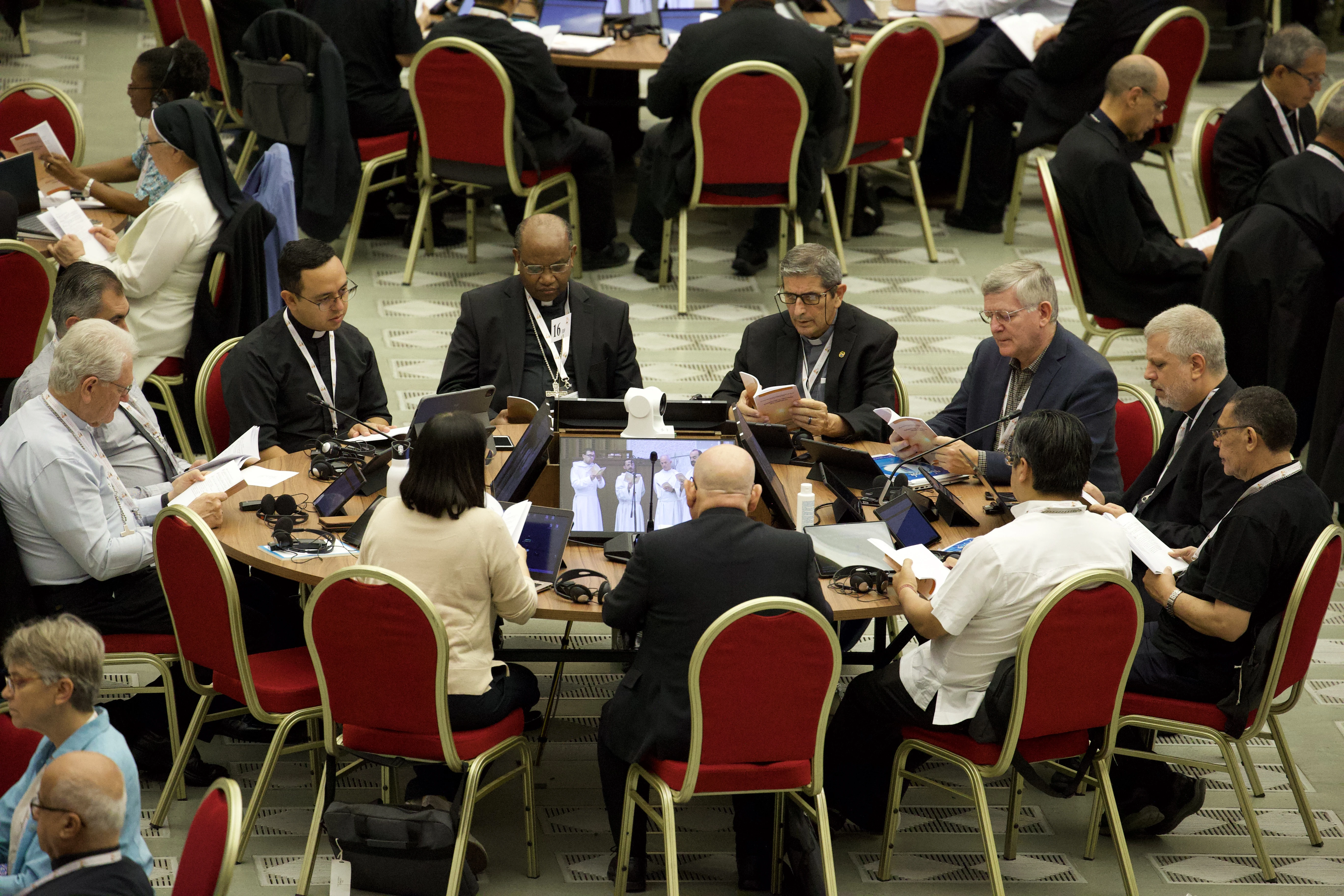 Father Ivan Montelongo, age 30 (seated at left), of El Paso, Texas, is one of 11 U.S. delegates to the Synod on Synodality.?w=200&h=150