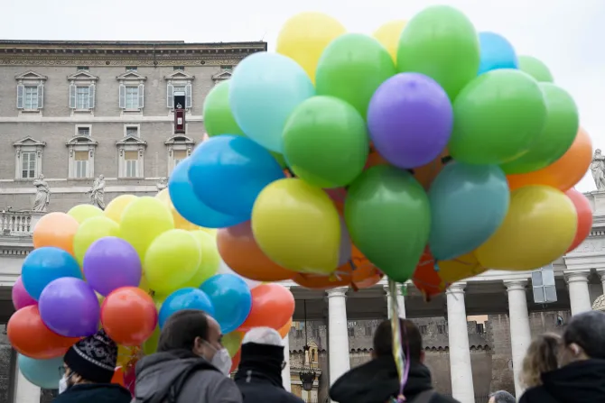 The crowd holds balloons as Pope Francis delivers the Angelus address on Jan. 30, 2022.