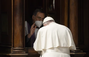 Pope Francis goes to confession during a penance service in St. Peter's Basilica on March 25, 2022. Vatican Media.
