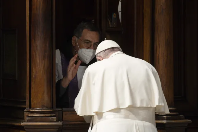 Pope Francis goes to confession during a penance service in St. Peter's Basilica on March 25, 2022.