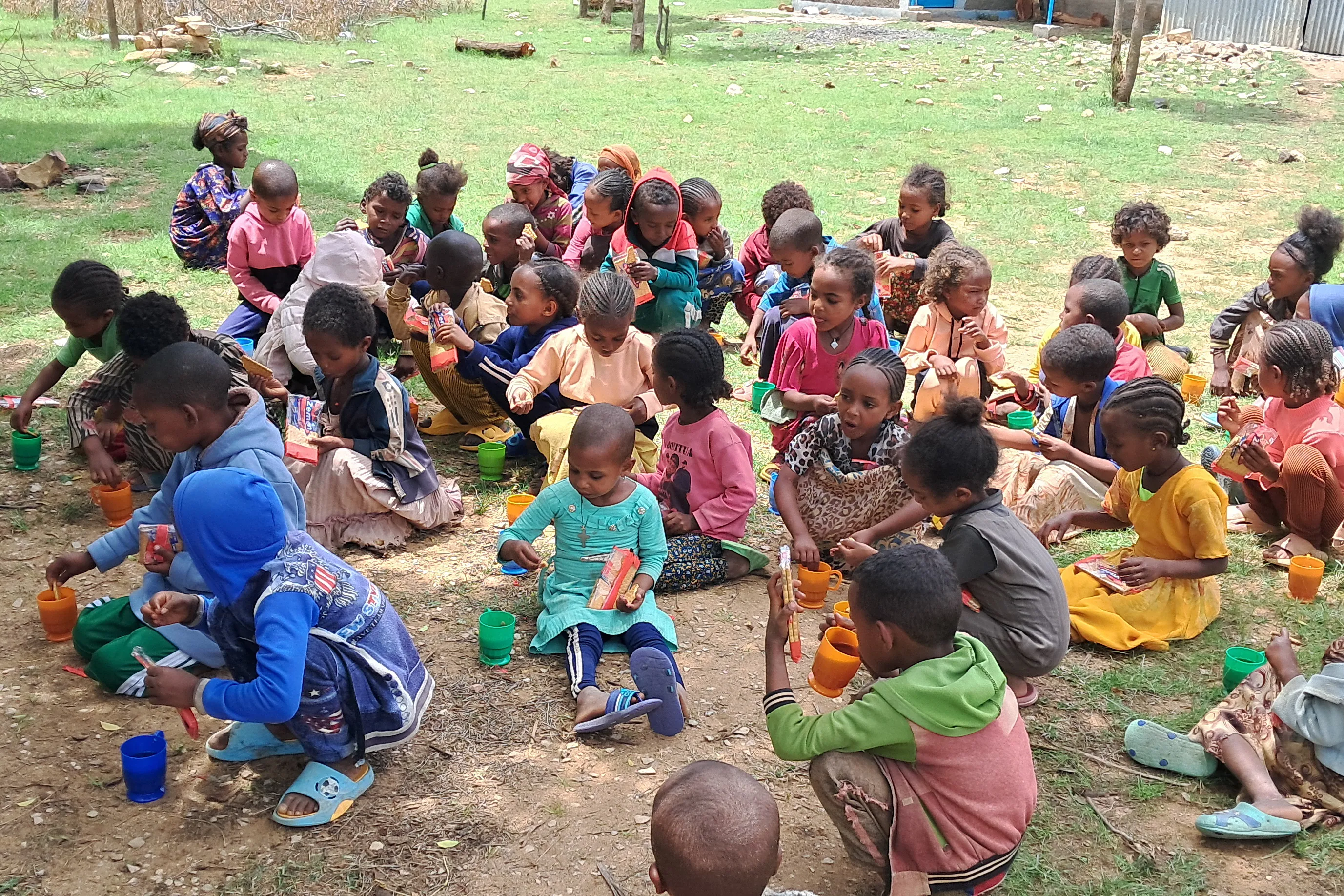 Schoolchildren in Tigray, Ethiopia, eat biscuits and tea provided by Mary's Meals.?w=200&h=150