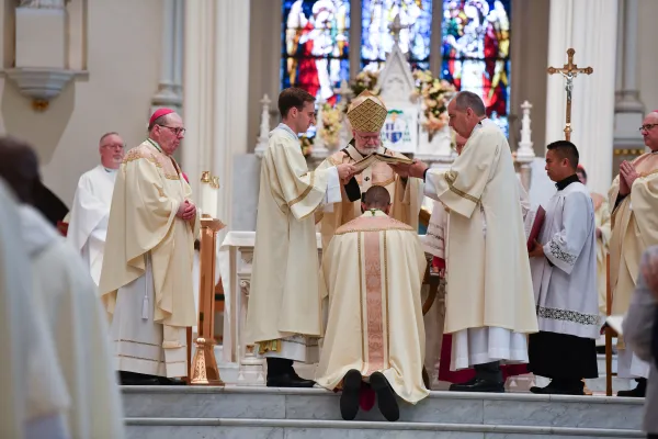 Bishop James Ruggieri kneels during his ordination Mass in Portland, Maine, on May 7, 2024. Credit: McKenney Photography