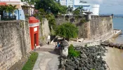 Scene of the walled city of Old San Juan, Puerto Rico. The oldest Governor's Mansion under the American flag, La Fortaleza, is top right.