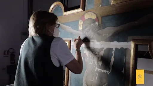 An art restorationist works on the Cross of Sant’Eutizio in the Vatican Museums’ laboratory. Credit: Vatican Museums