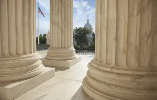 U.S. Capitol viewed through the columns of the U.S. Supreme Court in Washington, D.C. Credit: Shutterstock