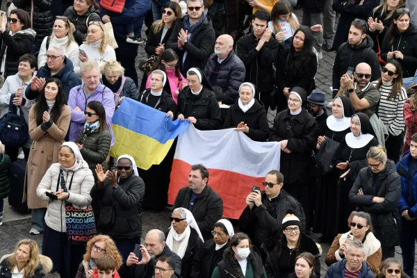 People held up Ukrainian and Polish flags at the Angelus address on Jan. 8, 2023. Vatican Media