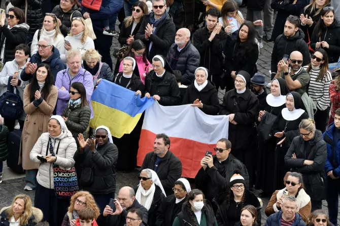 People held up Ukrainian and Polish flags at the Angelus address on Jan. 8, 2023.