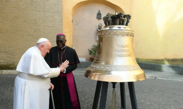 Pope Francis blesses a large bell engraved with the words “Voice of the Unborn,” which will be installed in Lusaka, Zambia, after his general audience March 22, 2023. Vatican Media