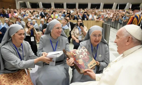 Pope Francis meets with a pilgrimage group led by the Sister Disciples of Jesus in the Eucharist in the Vatican's Paul VI Hall on Aug. 25, 2023. Vatican Media