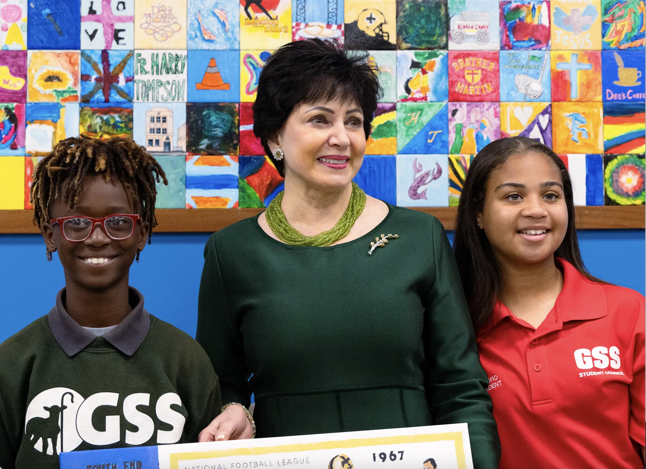 New Orleans Saints and Pelicans owner Gayle Benson pictured with two students at Good Shepherd School in New Orleans, where she announced her decision to give a large donation to fund the opening of a second school in December 2023.?w=200&h=150