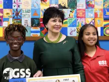 New Orleans Saints and Pelicans owner Gayle Benson pictured with two students at Good Shepherd School in New Orleans, where she announced her decision to give a large donation to fund the opening of a second school in December 2023.